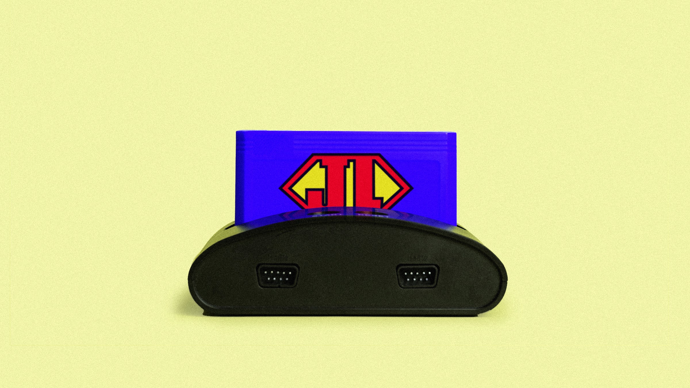 Old retro video game console with cartridge and a JL in a superman style.
